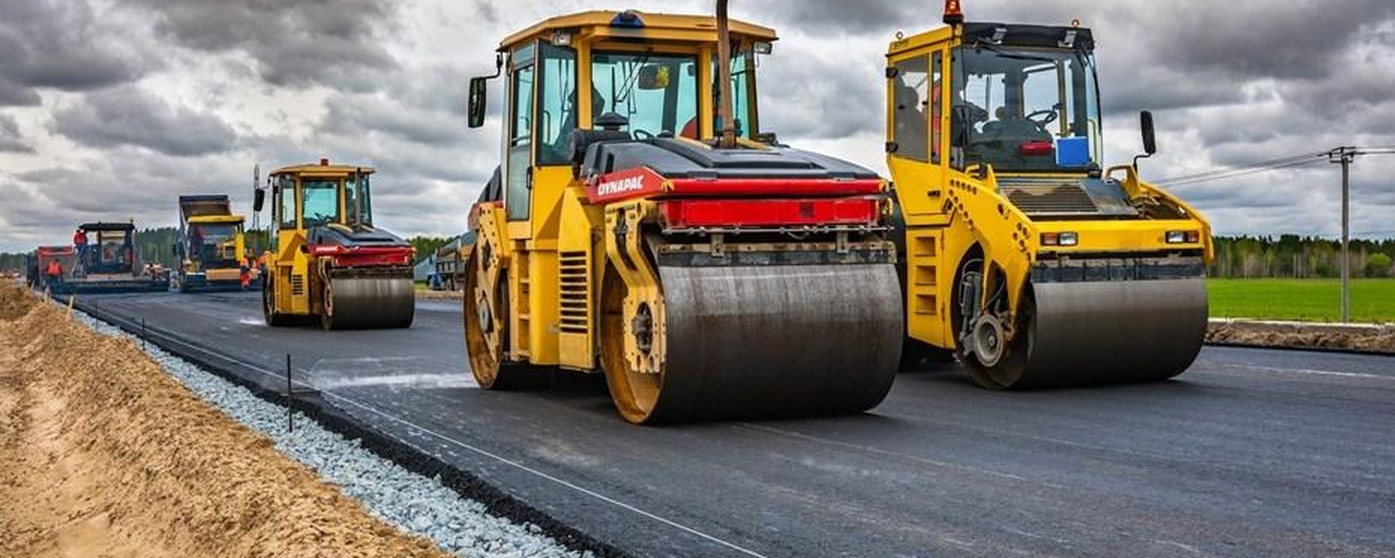 New asphalt layer laid next to the compacted crushed-stone base